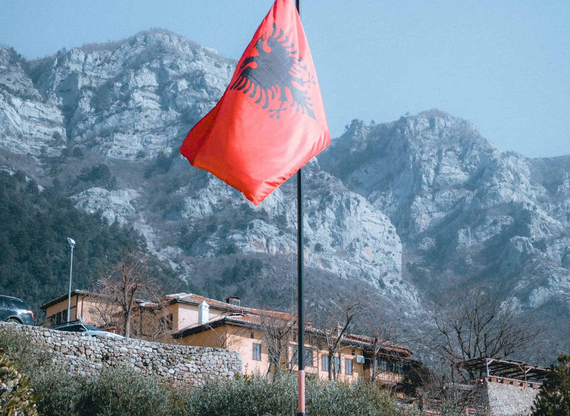 albanian-flag-mountain-backdrop